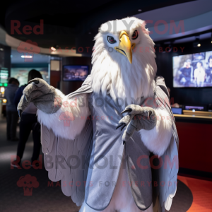 Silver Eagle mascot costume character dressed with a Jacket and Shawls