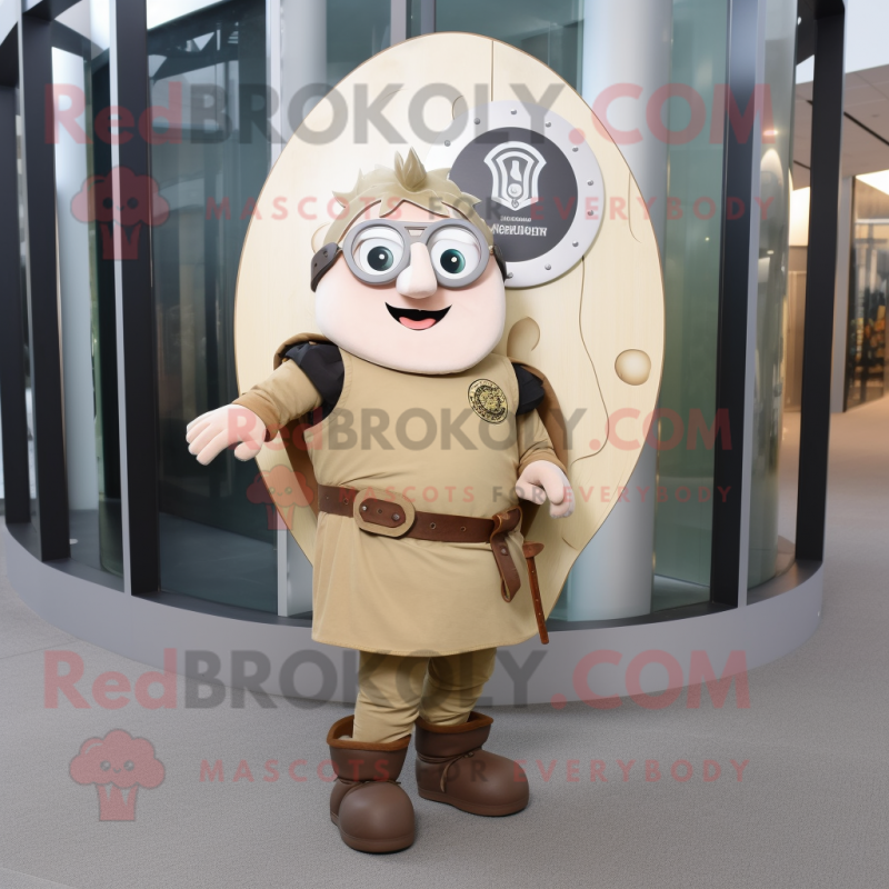 Beige Celtic Shield mascot costume character dressed with a Dungarees and Eyeglasses Beige Celtic Shield mascot costume character dressed with a Dungarees and Eyeglasses