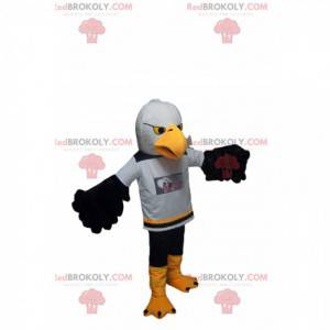 Golden Eagle maskot med en supporterströja. - Redbrokoly.com