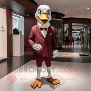 Maroon Swans mascot costume character dressed with a Suit Pants and Clutch bags