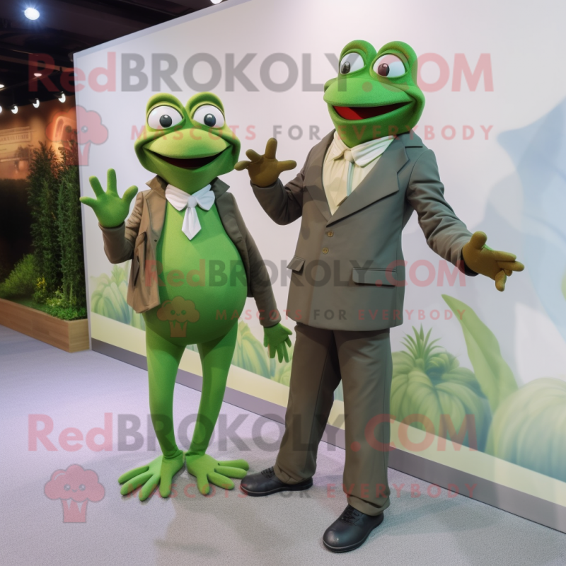 Olive Frog mascot costume character dressed with a Suit Jacket and Watches Olive Frog mascot costume character dressed with a Suit Jacket and Watches