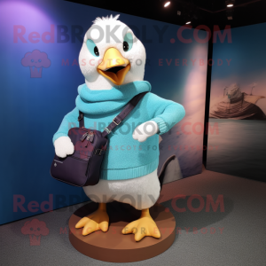 Turquoise Gull mascot costume character dressed with a Sweater and Messenger bags