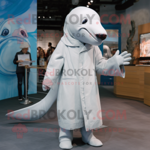Silver Beluga Whale mascot costume character dressed with a Coat and Shoe laces
