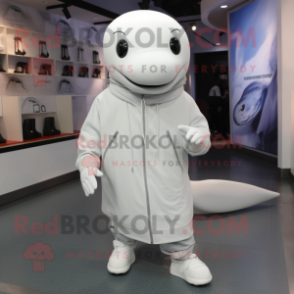 Silver Beluga Whale mascot costume character dressed with a Coat and Shoe laces