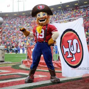 Mascotte del cowboy del coltivatore con un cappello e una tuta