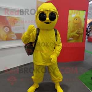 Lemon Yellow Para Commando mascot costume character dressed with a Windbreaker and Clutch bags