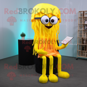 Yellow Jellyfish mascot costume character dressed with a Jumpsuit and Reading glasses