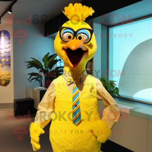 Yellow Peacock mascot costume character dressed with a Henley Shirt and Ties