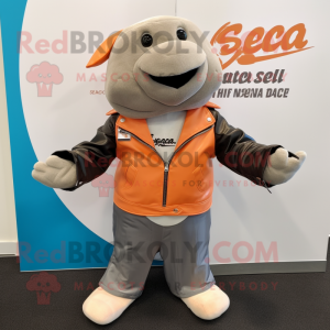 Peach Stellar'S Sea Cow mascot costume character dressed with a Biker Jacket and Pocket squares