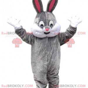 Mascotte grijs konijn met een mooie glimlach - Redbrokoly.com