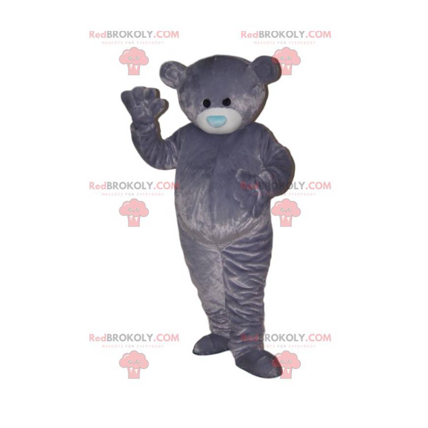 Mascotte orso molto morbido, con il suo muso blu. -