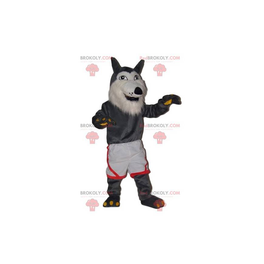 Mascotte de loup gris très joyeux avec un short blanc -