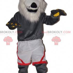 Very cheerful gray wolf mascot with white shorts -