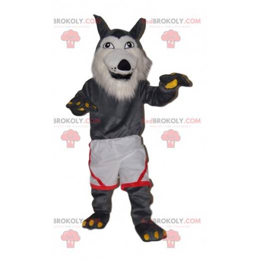 Mascote de lobo cinza muito alegre com shorts brancos -