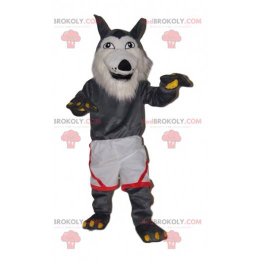 Mascotte de loup gris très joyeux avec un short blanc -