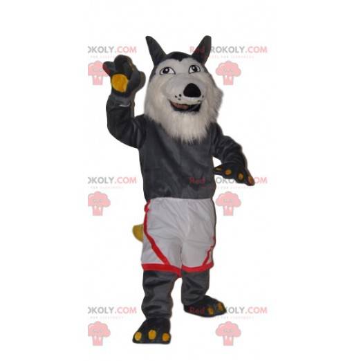 Mascotte de loup gris très joyeux avec un short blanc -