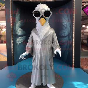 Silver Swan mascot costume character dressed with a Cover-up and Sunglasses