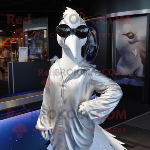 Silver Swan mascot costume character dressed with a Cover-up and Sunglasses