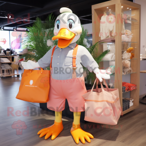 Peach Geese mascot costume character dressed with a Chinos and Tote bags