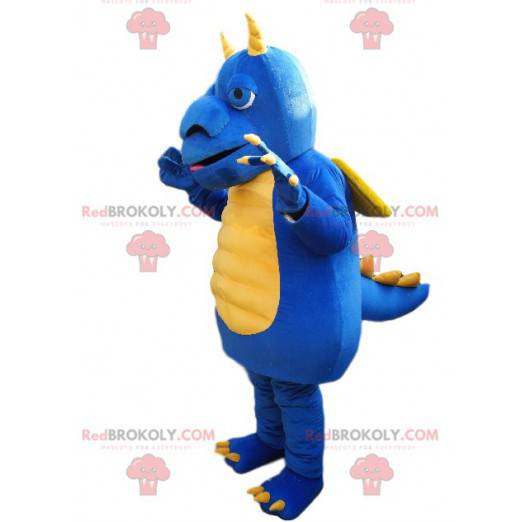Mascota dragón azul y amarillo con un gran hocico -