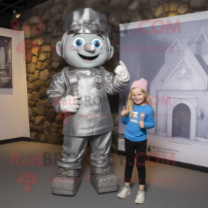 Silver Irish Castle mascot costume character dressed with a Dungarees and Watches