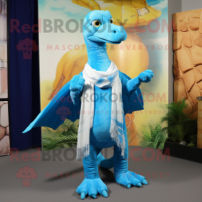 Sky Blue Coelophysis mascot costume character dressed with a Flare Jeans and Shawl pins