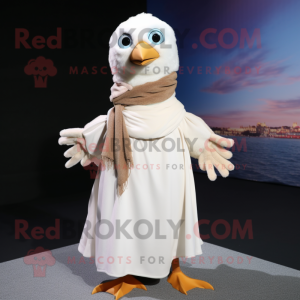 Cream Seagull mascot costume character dressed with a Wrap Dress and Scarves