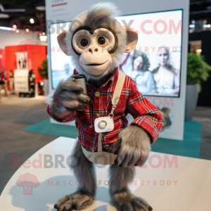 Silver Capuchin Monkey mascot costume character dressed with a Flannel Shirt and Smartwatches