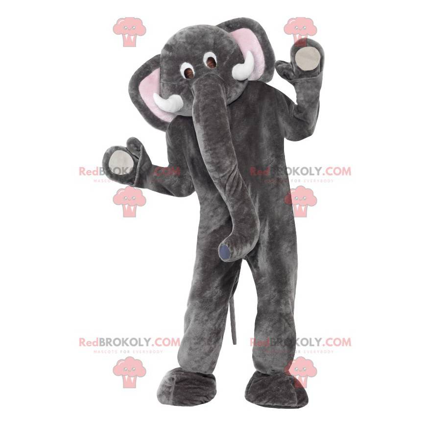 Mascota elefante gris y blanco con una gran trompa -