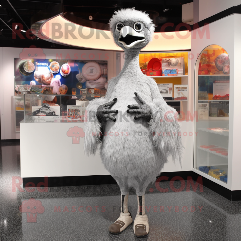 Silver Ostrich mascot costume character dressed with a Long Sleeve Tee and Coin purses