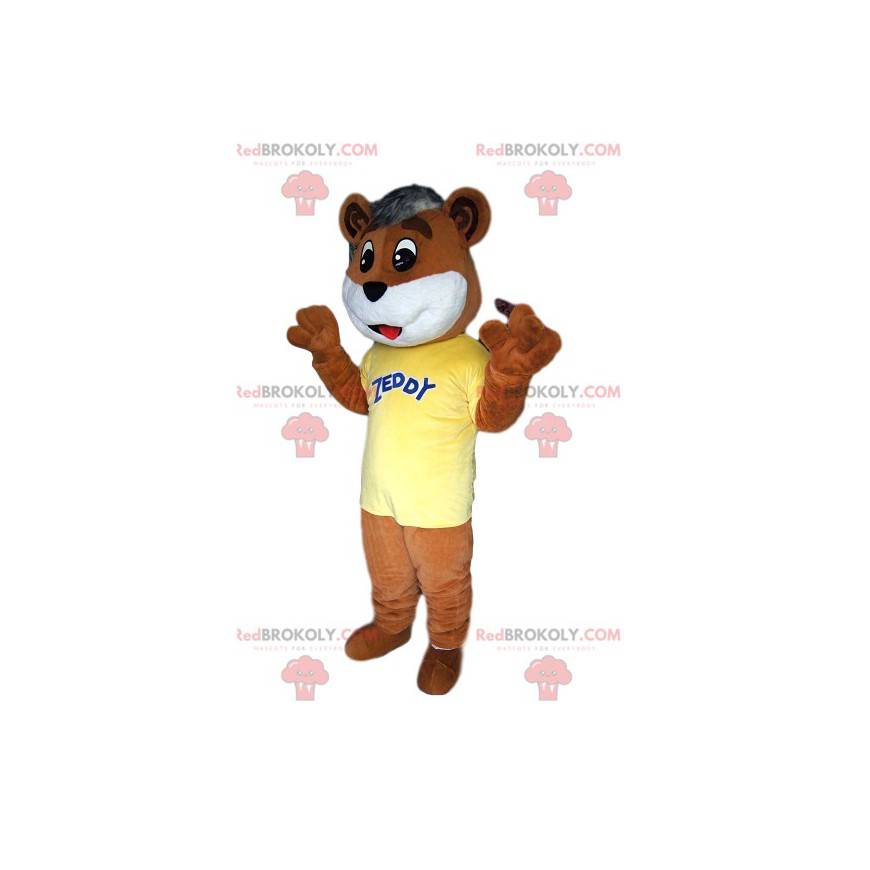 Mascotte dell'orso bruno che tocca, con la sua maglia gialla -