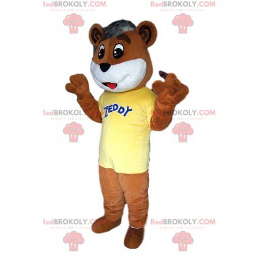 Brun bjørnemaskot rørende med sin gule trøje - Redbrokoly.com