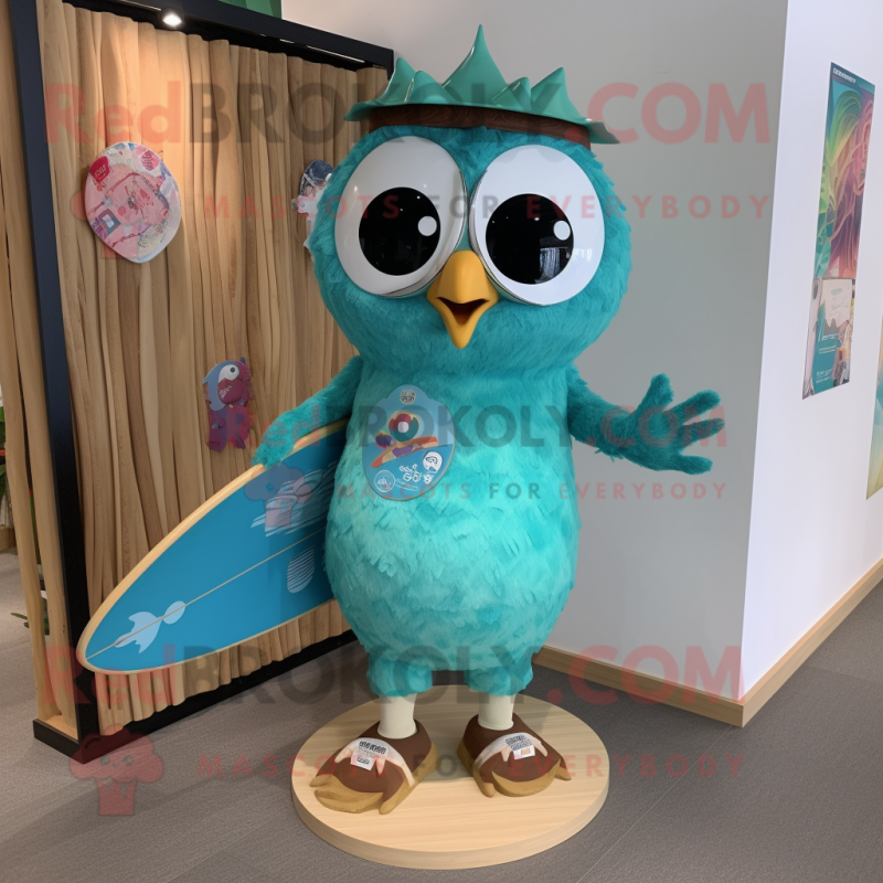 Turquoise Owl mascot costume character dressed with a Board Shorts and Hairpins