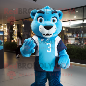 Cyan Puma mascot costume character dressed with a Rugby Shirt and Keychains