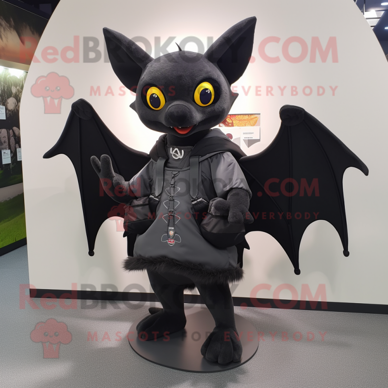 Black Bat mascot costume character dressed with a Vest and Messenger bags Black Bat mascot costume character dressed with a Vest and Messenger bags