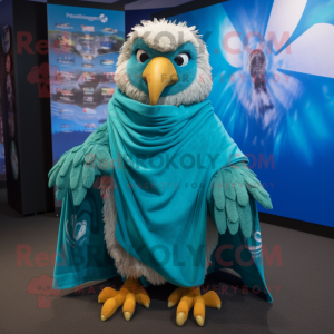 Turquoise Vulture mascot costume character dressed with a Romper and Shawls