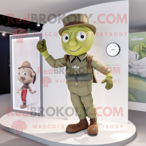 Olive Trapeze Artist mascot costume character dressed with a Chinos and Smartwatches
