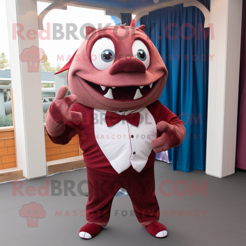 Maroon Tuna mascot costume character dressed with a Sweatshirt and Bow ties Maroon Tuna mascot costume character dressed with a Sweatshirt and Bow ties