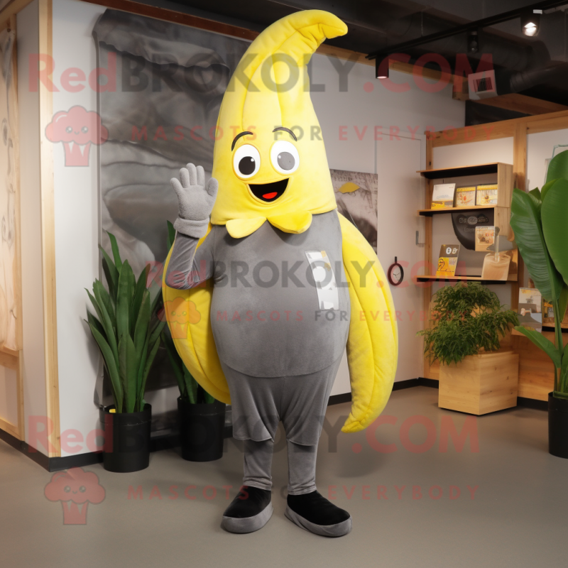 Gray Banana mascot costume character dressed with a Leggings and Mittens