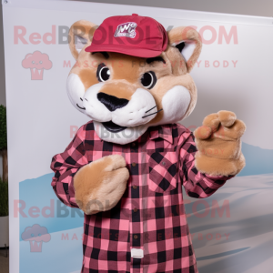 Pink Mountain Lion mascot costume character dressed with a Flannel Shirt and Hats