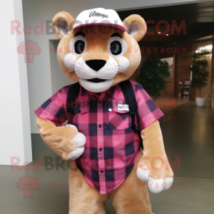 Pink Mountain Lion mascot costume character dressed with a Flannel Shirt and Hats