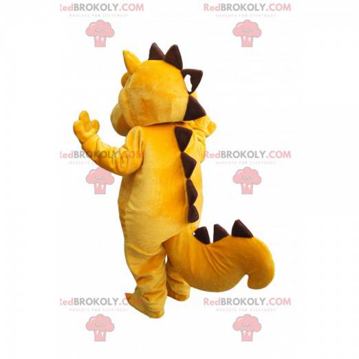 Trauriges gelbes und braunes Dinosauriermaskottchen -