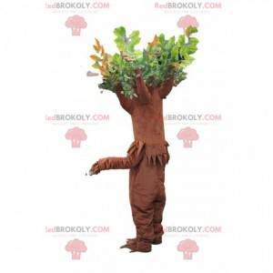 Brun træ maskot med grønne blade - Redbrokoly.com