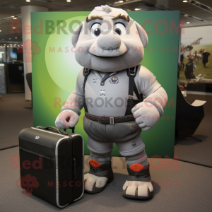 Gray Computer mascot costume character dressed with a Rugby Shirt and Briefcases