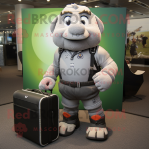 Gray Computer mascot costume character dressed with a Rugby Shirt and Briefcases