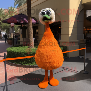 Orange Ostrich mascot costume character dressed with a Wrap Dress and Tie pins