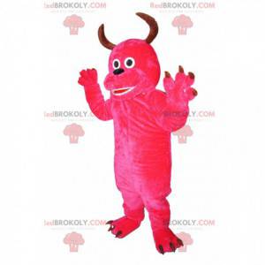 Mascotte de monstre fushia enjoué avec des cornes -