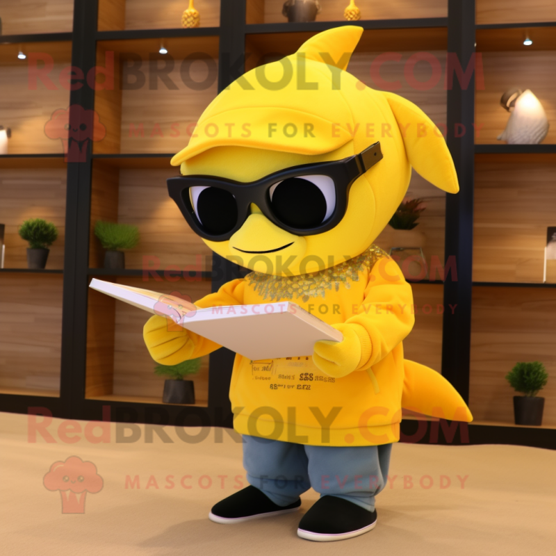 Yellow Dolphin mascot costume character dressed with a Sweater and Reading glasses