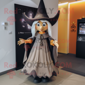 Tan Witch mascot costume character dressed with a Dress and Brooches