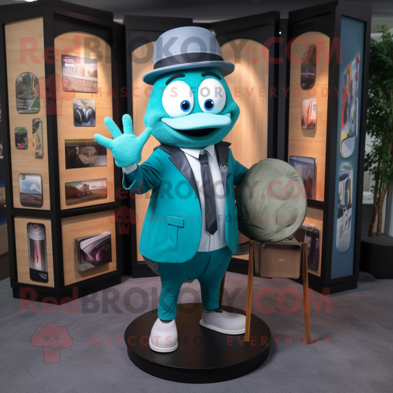 Teal Plate Spinner mascot costume character dressed with a Suit Jacket and Messenger bags Teal Plate Spinner mascot costume character dressed with a Suit Jacket and Messenger bags